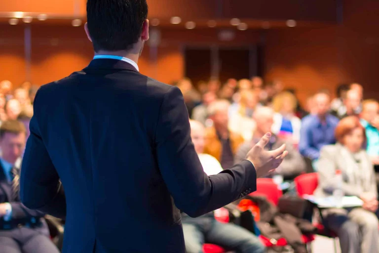 On stage — keynote moment, audience